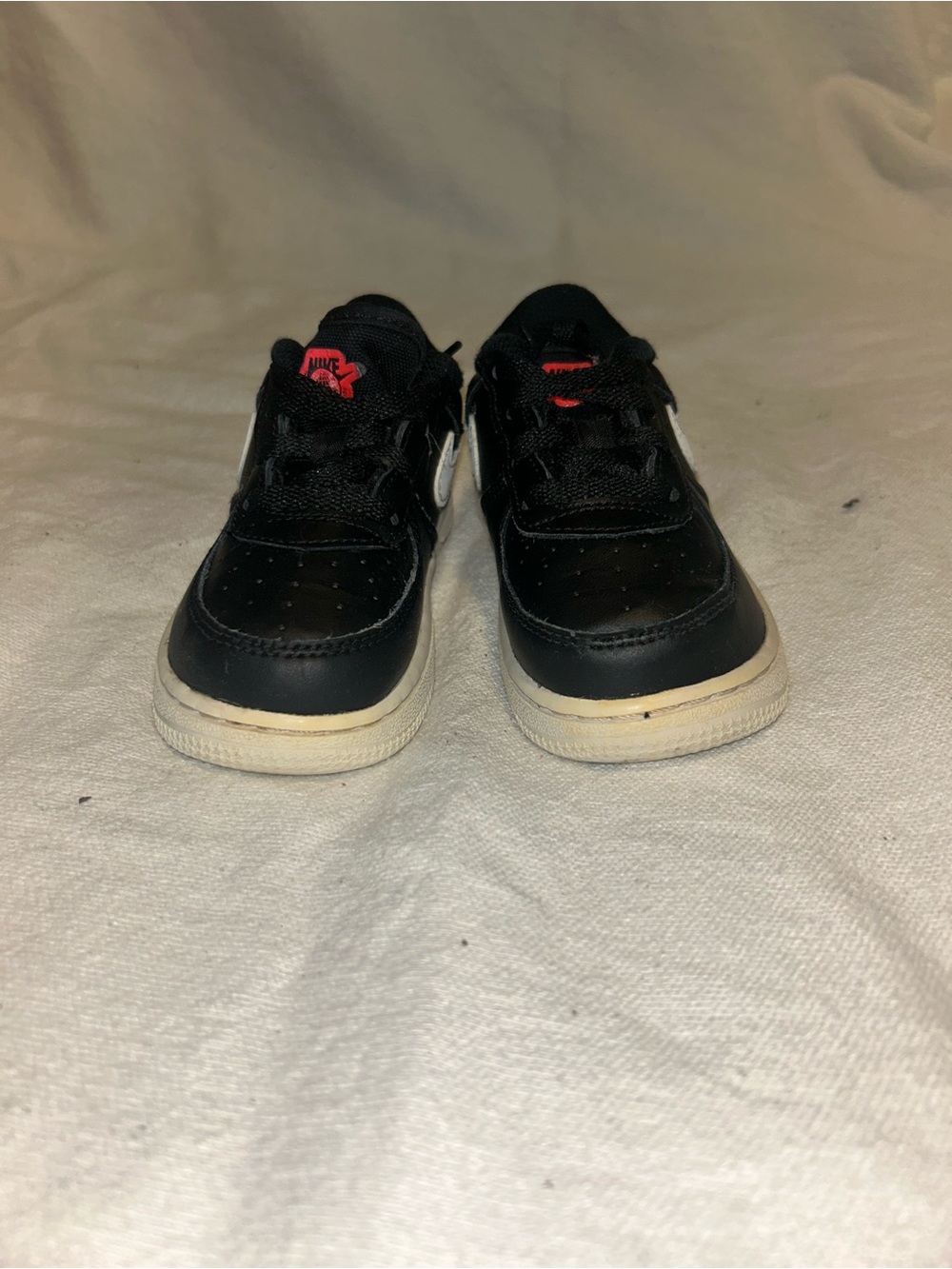 Nike Kids Black Sneakers with White Soles and Red Logo